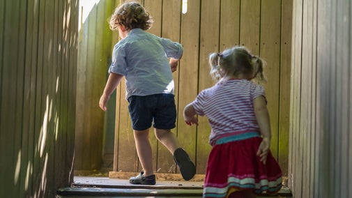 Children playing in Woodland Playground at Waddesdon